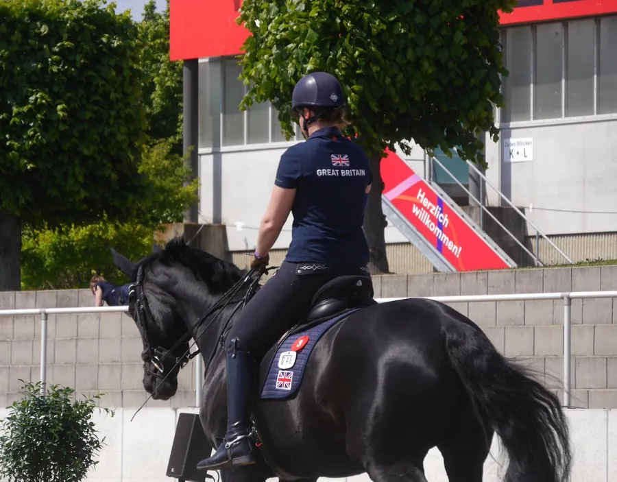 Amanda in a Great Britain team shirt warming up at an international show in Germany