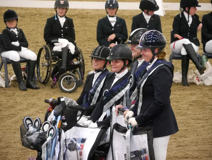 Amanda and British team-mates in FEI CPEDI3* sashes at an indoor prize-giving