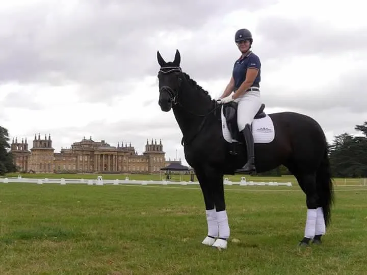 Amanda on a black horse with Blenheim Palace in the background