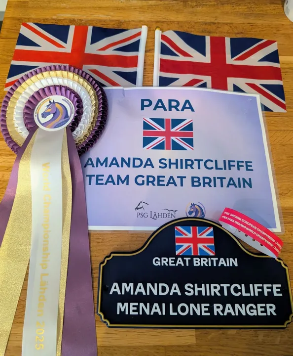 World Championship Lähden 2025 rosette, a Para Team Great Britain sign and a carriage plate reading Amanda Shirtcliffe, Menai Lone Ranger