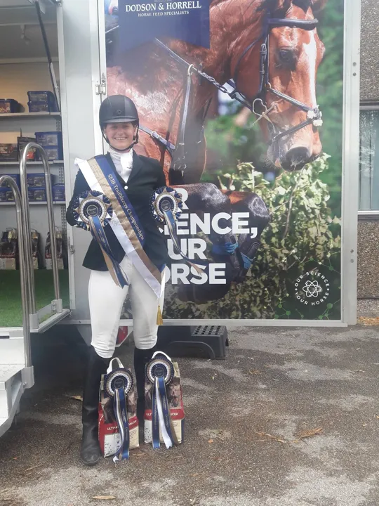 Amanda in a champion’s sash with her horse at the Trailblazers championships