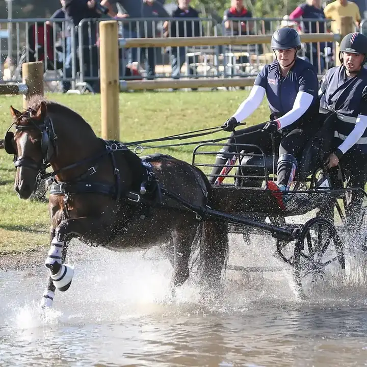 Amanda driving Ranger through the water at the 2025 Para Driving World Championships